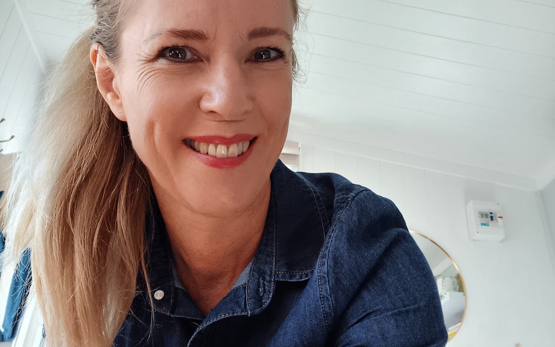Jan, the life coach at Agent For Change wearing a blue shirt.