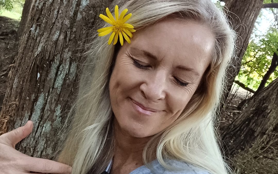 Jan hugging a tree.