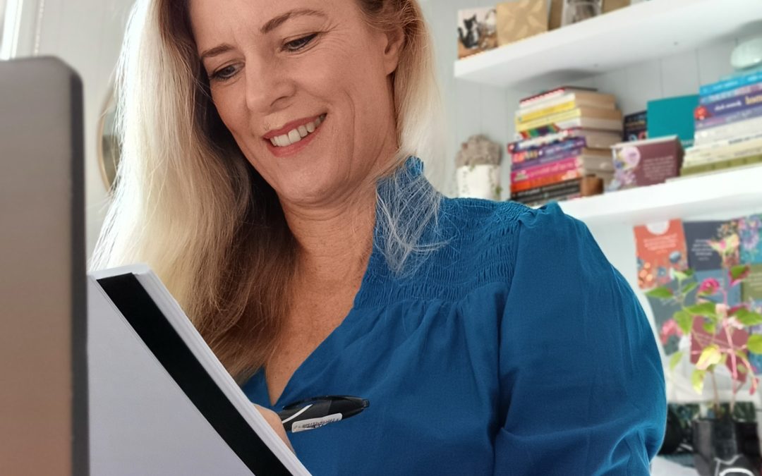 Jan looking at her schedule as a life coach.